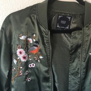Green bomber jacket with bird embroidery